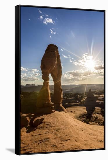 Delicate Arch with sun and clouds at golden hour, Arches National Park, Moab, Grand County, Utah, U-Francesco Vaninetti-Framed Stretched Canvas