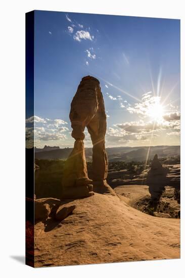 Delicate Arch with sun and clouds at golden hour, Arches National Park, Moab, Grand County, Utah, U-Francesco Vaninetti-Stretched Canvas