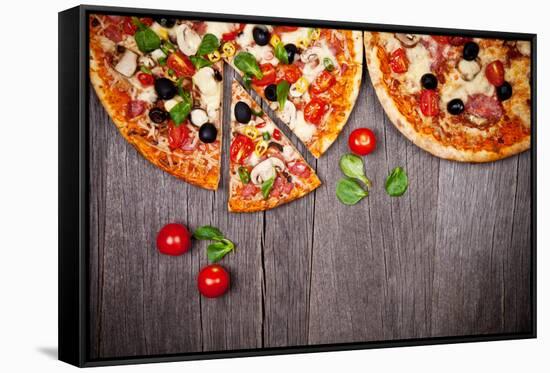 Delicious Italian Pizzas Served on Wooden Table-Jag_cz-Framed Stretched Canvas