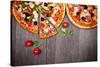 Delicious Italian Pizzas Served on Wooden Table-Jag_cz-Stretched Canvas