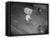 Delivery Boy Riding Bicycle with Box on Head-null-Framed Stretched Canvas