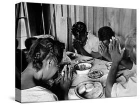 Delta and Pine Company African American Sharecropper Lonnie Fair and Family Praying before a Meal-Alfred Eisenstaedt-Stretched Canvas