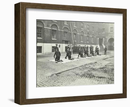 Demonstrating How to Pick Up an Unconscious Person, London Fire Brigade Headquarters, London, 1910-null-Framed Photographic Print