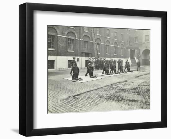 Demonstrating How to Pick Up an Unconscious Person, London Fire Brigade Headquarters, London, 1910-null-Framed Photographic Print