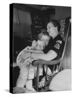 Den Mother Still in Uniform, Sleeping While Holding Her Daughter-null-Stretched Canvas