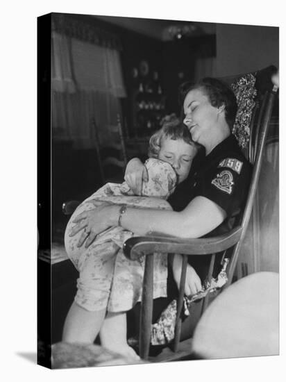 Den Mother Still in Uniform, Sleeping While Holding Her Daughter-null-Stretched Canvas
