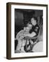 Den Mother Still in Uniform, Sleeping While Holding Her Daughter-null-Framed Photographic Print