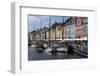 Denmark, Copenhagen, Nyhavn district. Colorful 17th and 18th century buildings, boats and canal-Alan Klehr-Framed Photographic Print