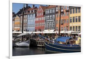 Denmark, Copenhagen, Nyhavn district. Colorful 17th and 18th century buildings, boats and canal-Alan Klehr-Framed Photographic Print