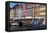 Denmark, Copenhagen, Nyhavn district. Colorful 17th and 18th century buildings, boats and canal-Alan Klehr-Framed Stretched Canvas