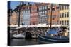 Denmark, Copenhagen, Nyhavn district. Colorful 17th and 18th century buildings, boats and canal-Alan Klehr-Stretched Canvas