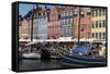 Denmark, Copenhagen, Nyhavn district. Colorful 17th and 18th century buildings, boats and canal-Alan Klehr-Framed Stretched Canvas