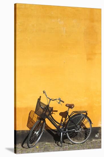 Denmark, Zealand, Copenhagen, Yellow Building Detail with Bicycle-Walter Bibikow-Stretched Canvas