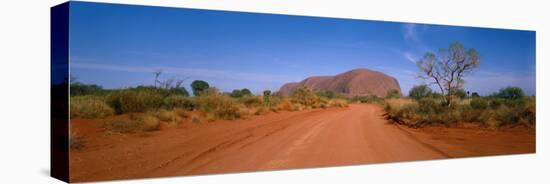 Desert Road and Ayers Rock, Australia-null-Stretched Canvas