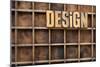 Design Word in Vintage Letterpress Wood Type against Divider Pattern of a Grunge Typesetter Case-PixelsAway-Mounted Art Print