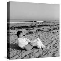 Designer Charles Eames Sitting on a Beach Near His Home-Peter Stackpole-Stretched Canvas