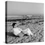 Designer Charles Eames Sitting on a Beach Near His Home-Peter Stackpole-Stretched Canvas