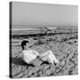 Designer Charles Eames Sitting on a Beach Near His Home-Peter Stackpole-Stretched Canvas