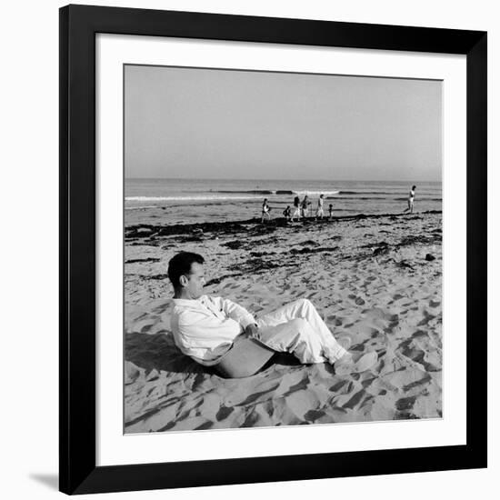 Designer Charles Eames Sitting on a Beach Near His Home-Peter Stackpole-Framed Premium Photographic Print