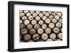 Detail Monochrome View of Stacked Wine and Whisky Wooden Barrels-MartinM303-Framed Photographic Print