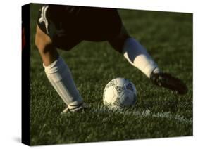 Detail of Foot About to Kick a Soccer Ball-Paul Sutton-Stretched Canvas