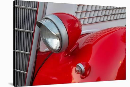 Detail of head lamp on red classic American Ford in Habana, Havana, Cuba.-Janis Miglavs-Stretched Canvas