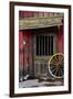 Detail of Old Wagon Wheel next to a Wooden Wild West Typical House-ccaetano-Framed Photographic Print