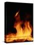 DETAIL OF ORANGE RED FLAMES OF A FIRE AGAINST BLACK BACKGROUND-Panoramic Images-Stretched Canvas