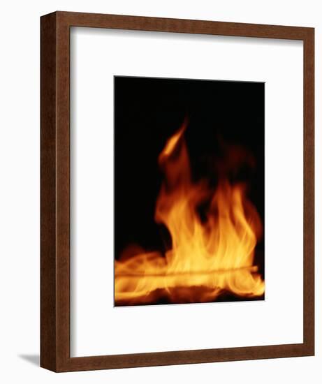 DETAIL OF ORANGE RED FLAMES OF A FIRE AGAINST BLACK BACKGROUND-Panoramic Images-Framed Photographic Print