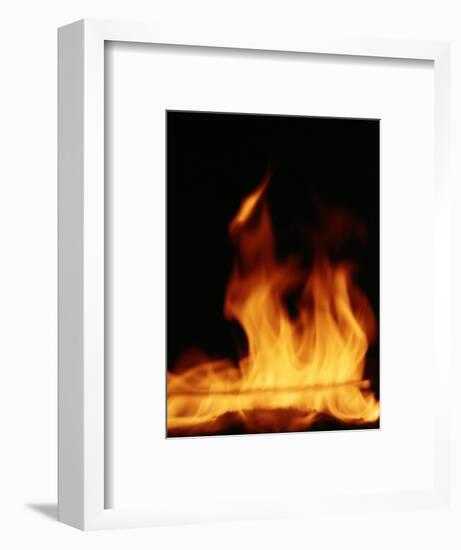 DETAIL OF ORANGE RED FLAMES OF A FIRE AGAINST BLACK BACKGROUND-Panoramic Images-Framed Photographic Print