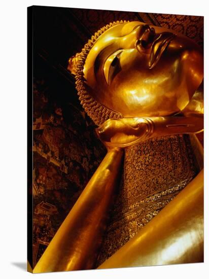 Detail of Reclining Buddha's Head at Wat Pho, Bangkok, Thailand-Ryan Fox-Stretched Canvas