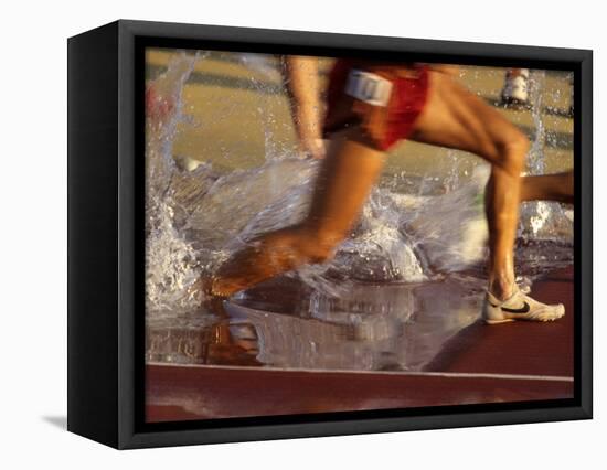 Detail of Runners Feet in Water Jump of Steeplechase Race-null-Framed Stretched Canvas