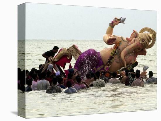 Devotees Immerse a Giant Clay Idol of Hindu Elephant-Headed God Ganesh into the Arabian Sea, Bombay-null-Stretched Canvas