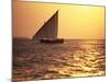 Dhow in Silhouette on the Indian Ocean at Sunset, off Stone Town, Zanzibar, Tanzania, East Africa-Lee Frost-Mounted Photographic Print