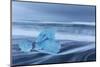 Diamond ice chards from calving icebergs on black sand beach, Jokulsarlon, south Iceland-Chuck Haney-Mounted Photographic Print