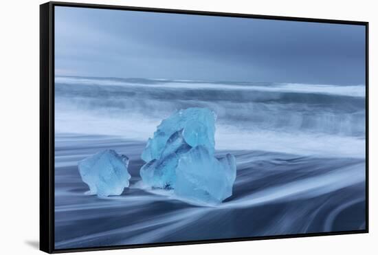 Diamond ice chards from calving icebergs on black sand beach, Jokulsarlon, south Iceland-Chuck Haney-Framed Stretched Canvas