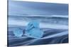 Diamond ice chards from calving icebergs on black sand beach, Jokulsarlon, south Iceland-Chuck Haney-Stretched Canvas