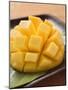 Diced Mango Still Attached to the Skin on Brown Plate-null-Mounted Premium Photographic Print