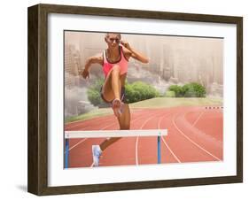 Digital Composite Image of Female Athlete Jumping above the Hurdle against Cityscape Background-vectorfusionart-Framed Photographic Print