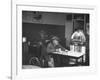 Dilapidated Shabby Man Sitting at the Table with a Cup of Coffee, Listening Dreamily to the Music-Peter Stackpole-Framed Premium Photographic Print