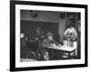 Dilapidated Shabby Man Sitting at the Table with a Cup of Coffee, Listening Dreamily to the Music-Peter Stackpole-Framed Premium Photographic Print