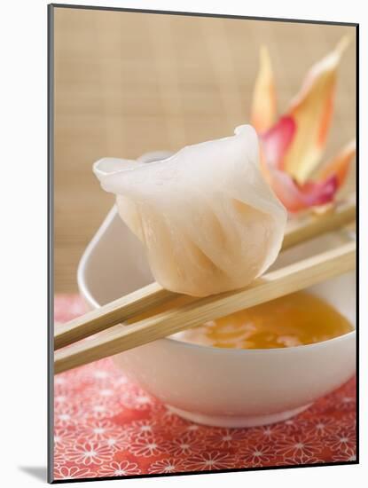 Dim Sum on Chopsticks over Dip (Asia)-null-Mounted Photographic Print