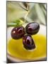 Dipping Olive Sprig with Black Olives in Olive Oil-null-Mounted Premium Photographic Print