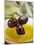 Dipping Olive Sprig with Black Olives in Olive Oil-null-Mounted Photographic Print