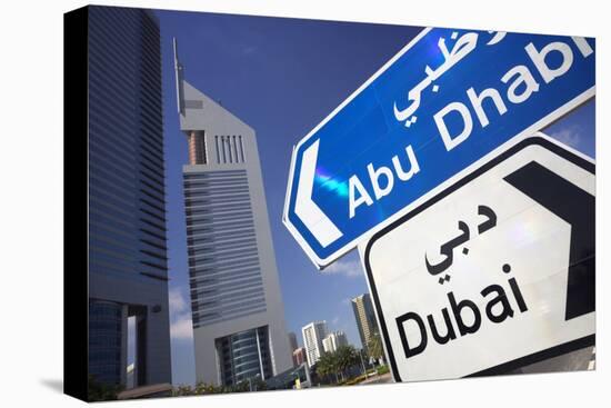 Direction Signs on Sheikh Zayed Road in Dubai-Jon Hicks-Stretched Canvas