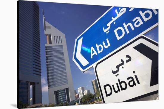 Direction Signs on Sheikh Zayed Road in Dubai-Jon Hicks-Stretched Canvas