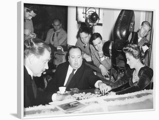 Director Hitchcock Directing a Scrabble Scene with Joan Fontaine in Suspicion-null-Framed Photo