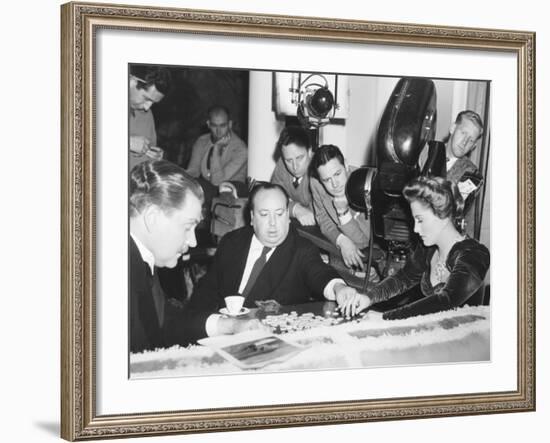 Director Hitchcock Directing a Scrabble Scene with Joan Fontaine in Suspicion-null-Framed Photo