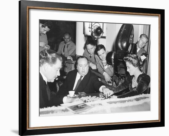 Director Hitchcock Directing a Scrabble Scene with Joan Fontaine in Suspicion-null-Framed Photo