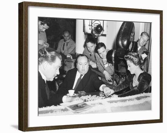 Director Hitchcock Directing a Scrabble Scene with Joan Fontaine in Suspicion-null-Framed Photo